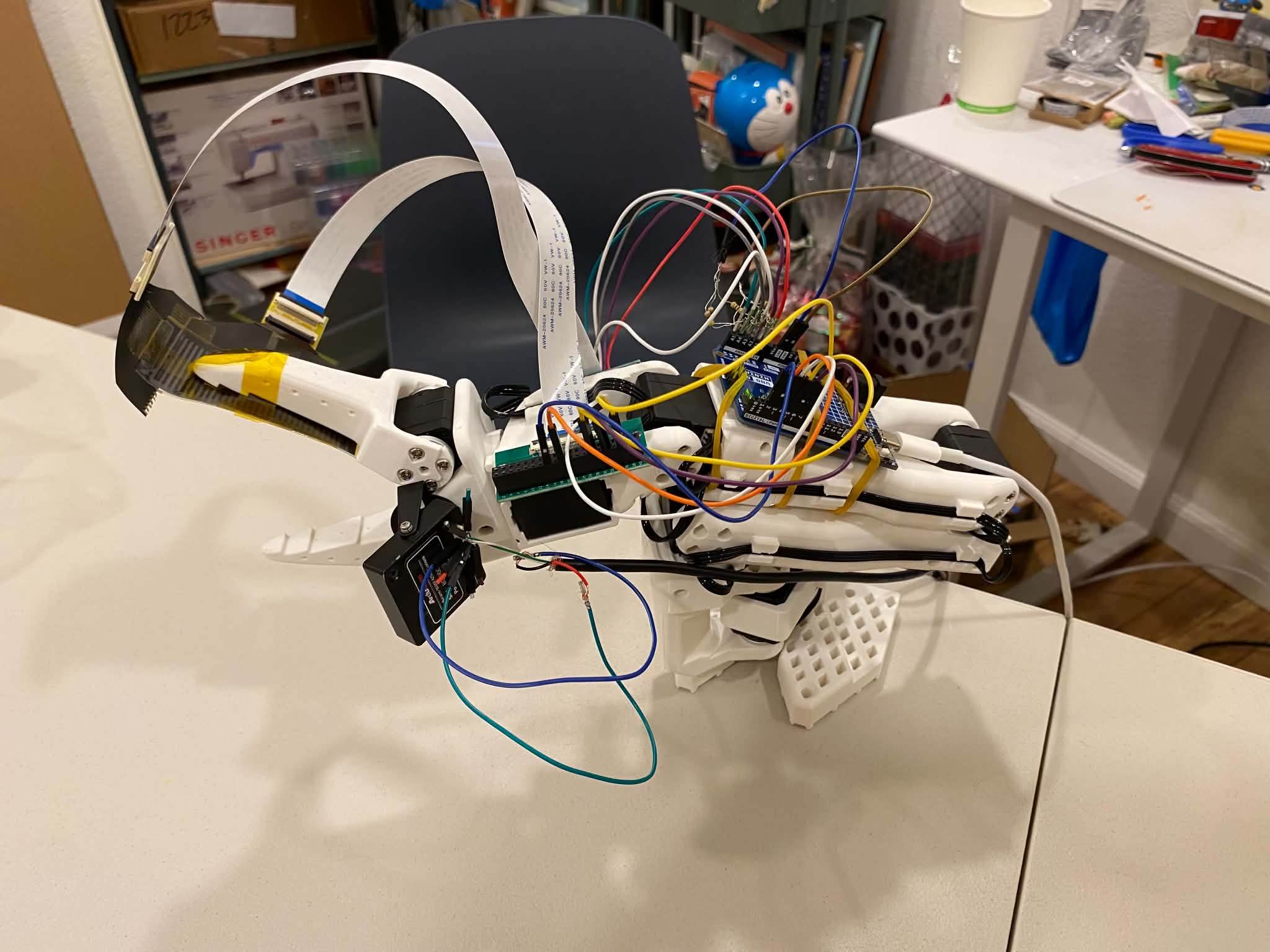 The SO-101 arm and gripper, with the tactile sensor on the moving jaw.